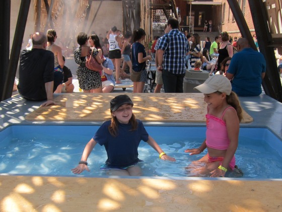 Two little girls playing in the CODA pools at MoMA PS1warm up party