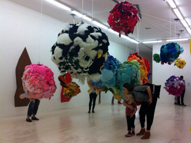 Mike Kelley's "Deodorized Central Mass With Satellites", which is the part of the exhibition which took stuffed animals and created big balls that hang from the ceiling resembling planets