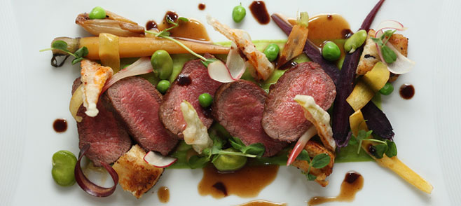 A Thanksgiving dish served at David Burke Townhouse with steak and vegetables presented on a white plate