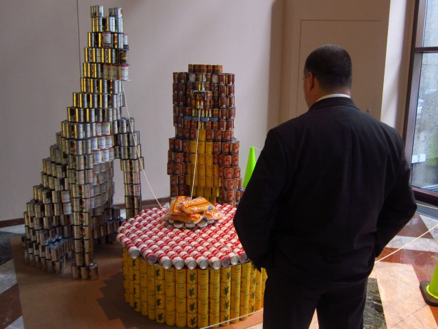 Very unique Canstruction entry of two dogs sipping up a spaghetti, a rendition of The Lady and the Tramp, by Arup 