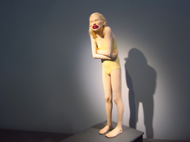From the MAD Body & Soul exhibition is this ceramic sculpture of a girl with big red lips wearing a yellow bathing suit