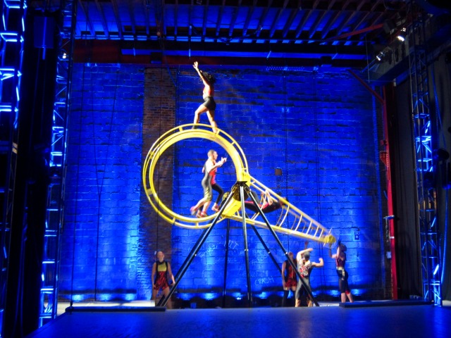 The STREB crew members on ROCKET, an elaborate spinning contraption that the company climbs and walks and flies all over