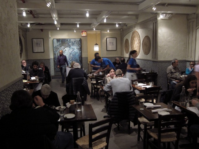 Image of the seating area filled with New York locals enjoying Kefi's Greek food on the Upper West Side