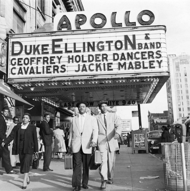 Vintage, black and white photograph of the Apollo Theater sign in Harlem, advertising the Duke Ellington Band