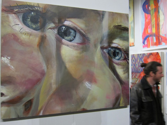A very large painting on canvas of a women's eye and nose 