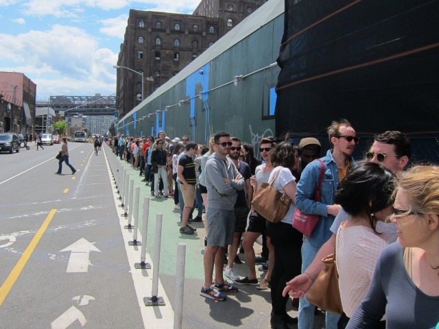 An image of the massive line of people waiting to get into Kara Walker's A Subtlety