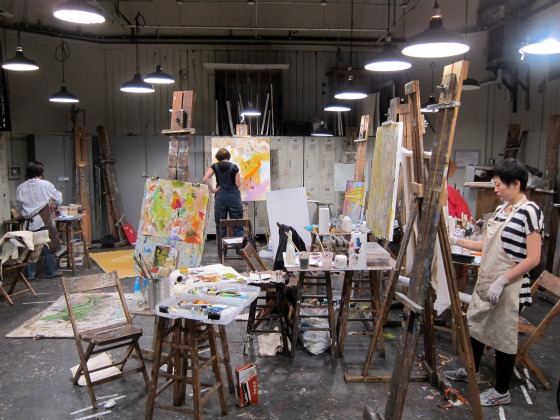 Students working on art inside the Art Students League of New York Adult students working on colorful canvases inside the independent art school, Art Students League of New York