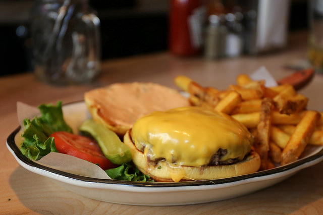 All-American burger with fries at Black Tap Craft Burgers and Bee in Soho, Manhattan.