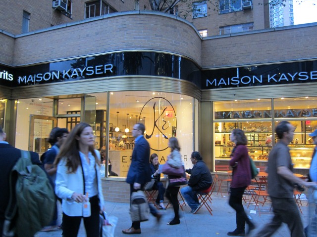 People walking on the sidewalk outside Maison Kayser's new location in Columbus Circle