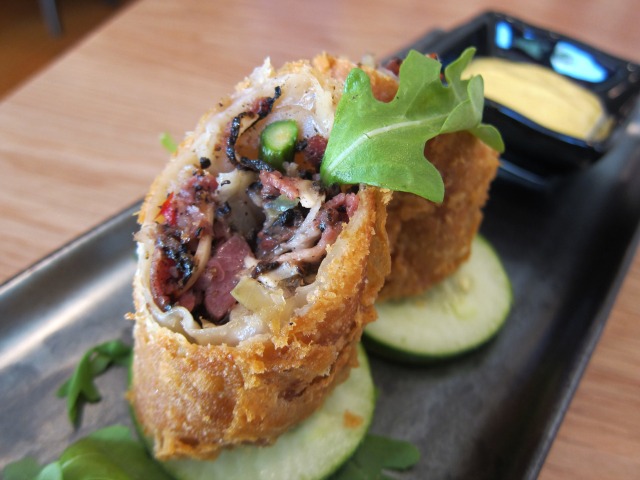 Image of the Pastrami Egg Rolls, with peppery pastrami rolled into a cruchy outter shell, off the menu of Red Farm