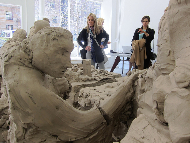 People standing at Gagosian Park Avenue Exhibition admiring Urs Fisher's Last Supper Sculptural piece